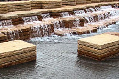 Water flowing through Mutual Materials pavers into a fountain